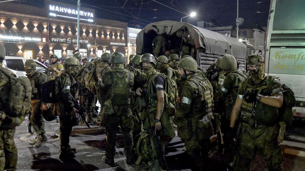 epa10710225 Private military company (PMC) Wagner Group servicemen prepare to leave downtown Rostov-on-Don, southern Russia, 24 June 2023. Security and armoured vehicles were deployed after the Chief of the private military company (PMC) Wagner Group said in a video that his troops had occupied the building of the headquarters of the Southern Military District, demanding a meeting with Russia's defense chiefs. The President of Belarus held talks with the head of the Wagner group, as a result of which he accepted a proposal to stop the movement of the group's fighters across Russia, the press service of the President of Belarus reported. The Chief of Wagner Group has said that columns of his group will return to field camps.  EPA/ARKADY BUDNITSKY