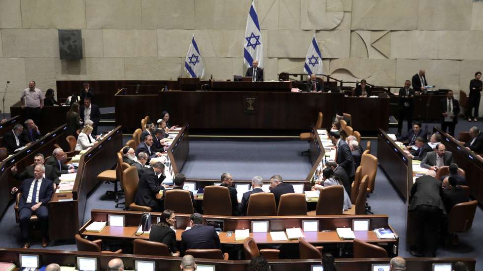 epa10766137 Israel's Knesset Speaker Amir Ohana (C) presides over a session to vote on law on justice system reform, Israel, 24 July 2023. Mass protests continue across the country as the Israeli parliament, or Knesset, is set to hold a final vote on the bill that would limit the Supreme Court's powers.  EPA/ABIR SULTAN