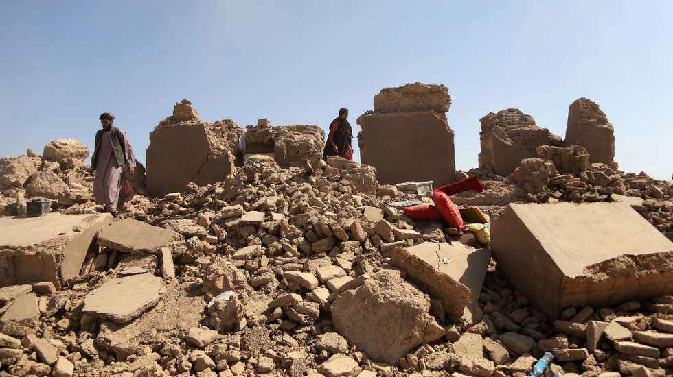 epa10912037 People salvage their belongings amid rubble of their house in earthquake-hit  Zinda Jan district of Herat, Afghanistan, 10 October 2023. A 6.3-magnitude earthquake and the consecutive aftershocks that struck western Afghanistan during the weekend killed nearly 3,000, according to estimates by the government and nonprofit organizations. Over 2,000 people were wounded and 20 villages completely destroyed in the tremors.  EPA/SAMIULLAH POPAL