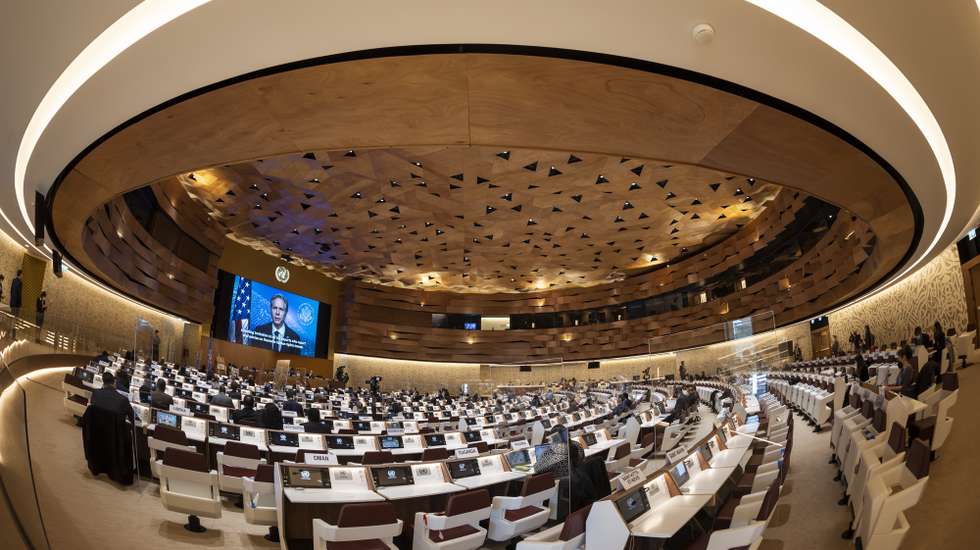epa09793950 U.S. Secretary of State Antony Blinken appears on a screen as he delivers a remote speech, to the 49th session of the UN Human Rights Council, at the European headquarters of the United Nations in Geneva, Switzerland, 01 March 2022.  EPA/SALVATORE DI NOLFI / POOL
