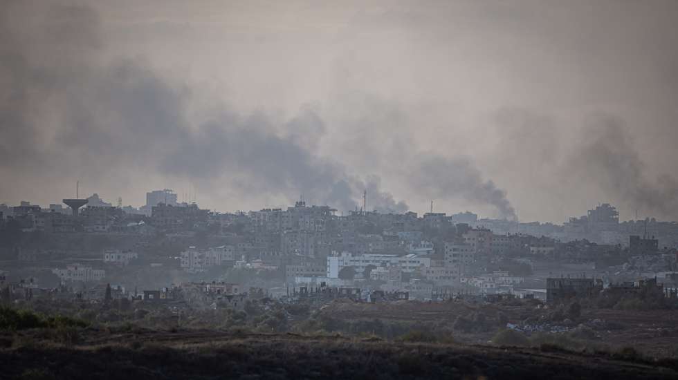 epa10999180 Smoke rises over damaged buildings on the northern part of the Gaza Strip, as seen from Sderot, southern Israel, 28 November 2023. The Israeli Defense Forces (IDF) announced on 28 November that three explosive devices were detonated near IDF troops in two locations in the northern Gaza Strip, in what it called a violation of 'the framework of the operational pause'. In one of the locations, Israeli troops were shot at and responded with fire. A number of soldiers were 'lightly injured' in the incidents, the statement added. Israel and Hamas agreed to a four-day ceasefire, mediated by Qatar, the US, and Egypt, that came into effect at 05:00 AM GMT on 24 November. On 27 November the ceasefire was extended by 48 hours.  EPA/CHRISTOPHE PETIT TESSON