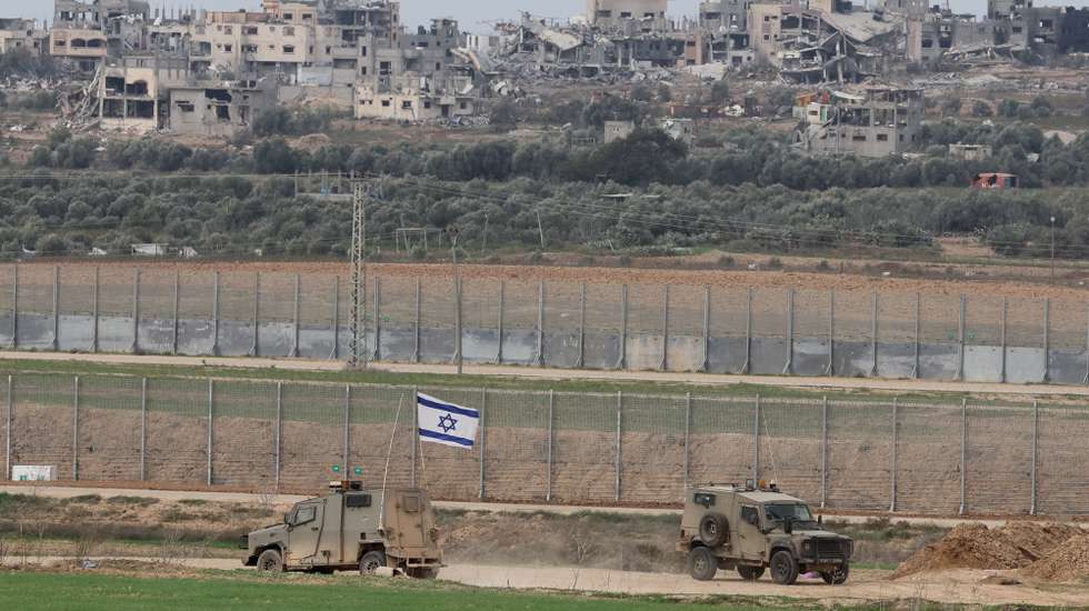 epa11039691 Israeli army jeeps patrol near Shujayya neighborhood in the Gaza Strip, as seen from southern Israel, 21 December 2023. More than 19,600 Palestinians and at least 1,200 Israelis have been killed, according to the Palestinian Health Ministry and the Israel Defense Forces (IDF), since Hamas militants launched an attack against Israel from the Gaza Strip on 07 October, and the Israeli operations in Gaza and the West Bank which followed it.  EPA/ABIR SULTAN