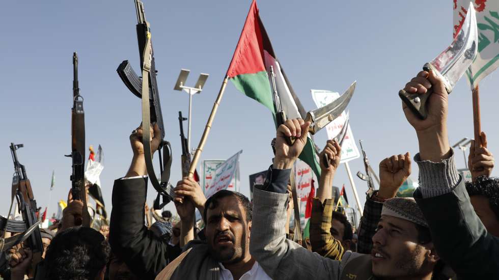 epa11041210 People hold Palestinian flags during a protest against the recently announced operation to safeguard trade and to protect ships in the Red Sea, in Sana'a, Yemen, 22 December 2023. Thousands of people gathered at a square in the Houthis-controlled Sana'a to protest against the coalition created recently by the United States and denounce the Israeli strikes on the Gaza Strip. On 18 December, the US Department of Defense announced a multinational operation to safeguard trade and to protect ships in the Red Sea amid the recent escalation in Houthi attacks originating from Yemen, according to a press release from the US Department of Defense. Thousands of Israelis and Palestinians have died since the militant group Hamas launched an unprecedented attack on Israel from the Gaza Strip on 07 October, and the Israeli strikes on the Palestinian enclave which followed it.  EPA/OSAMAH YAHYA