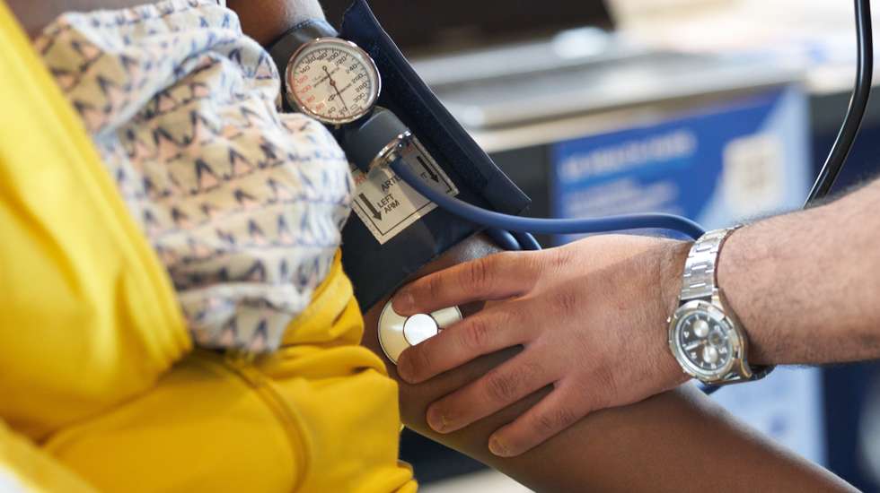 epa10794113 A woman gets her blood pressure checked at a back-to-school event for children and parents at Magic Johnson Park in Los Angeles, California, USA, 10 August 2023. Many schools in the Los Angeles area begin classes on 14 August.  EPA/ALLISON DINNER