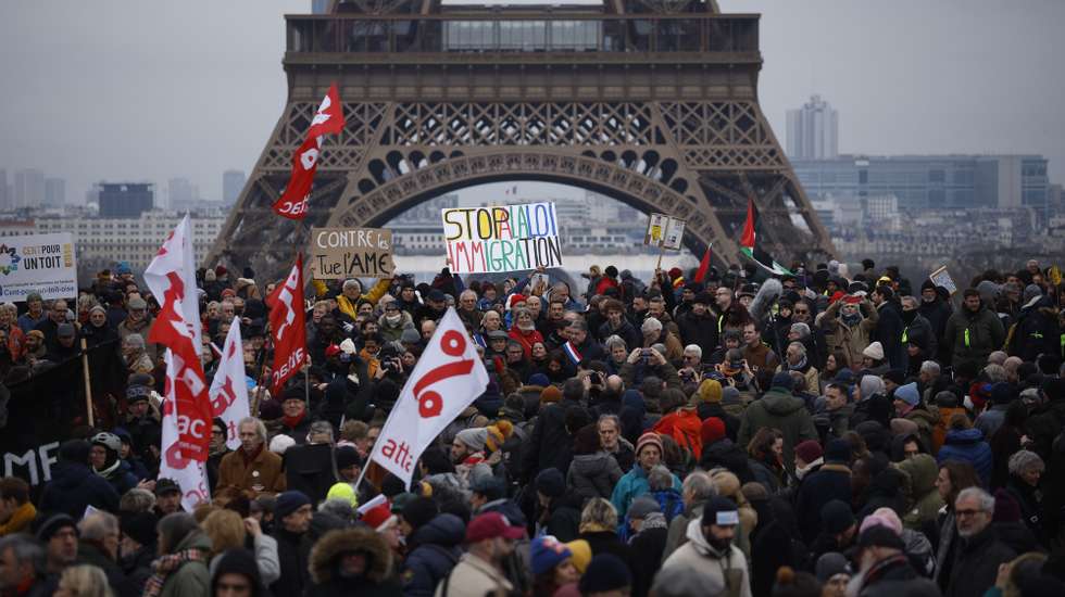 epa11094311 People gather in a demonstration organised by collectives of undocumented immigrants, unions, and left-wing parties, against the government's proposed new immigration laws, in Paris, France, 21 January 2024. The government's new immigration reform that aims to clamp down on illegal migration awaits the court's decision if it is constitutional.  EPA/YOAN VALAT