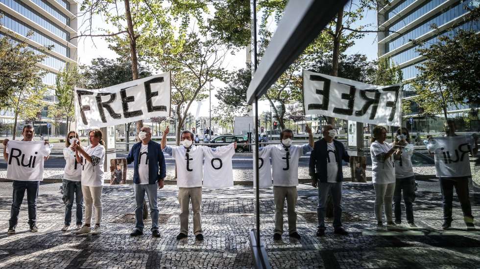 epaselect epa08645714 Supporters of Football Leaks whistleblower Rui Pinto (not pictured) wait outside Justice Campus where his trial is taking place in Lisbon, Portugal, 04 September 2020. Rui Pinto is on trial for 90 crimes, 68 of undue access, 14 of violation of correspondence, six of illegitimate access, and also for computer sabotage to Sporting's SAD and for extortion of the Doyen investment fund.  EPA/MARIO CRUZ