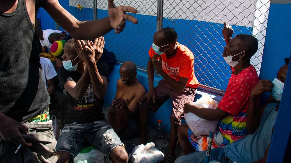 epa11197296 Prisioners rest inside a zone of the Haitian National Penitentiary, after the attack last night by armed gangs in Port-au-Prince, Haiti, 03 March 2024. At least a dozen people died after an attack last night on the Port-au-Prince civil prison by armed gangs, who reportedly freed numerous important criminals during their assault on the penitentiary.  EPA/Siffroy Clarens