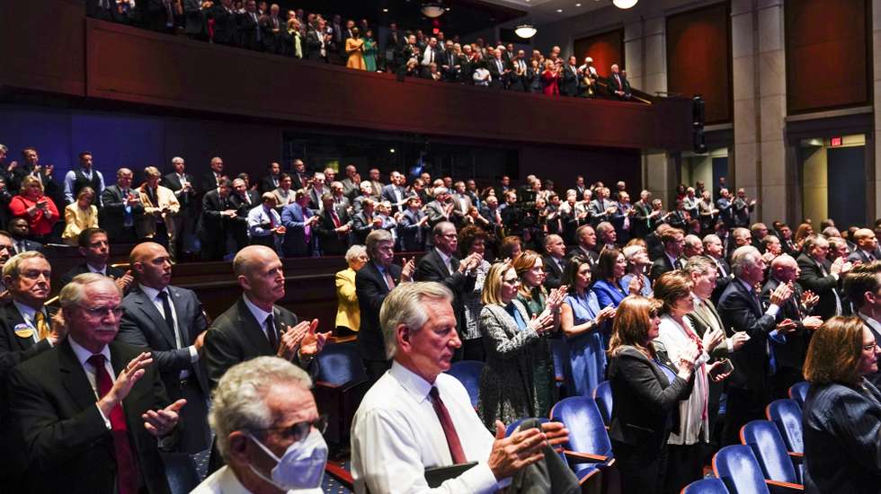 epa09829018 Members of the US Congress applaud as Ukraine's President Volodymyr Zelensky delivers a video address to senators and members of the House of Representatives gathered in the Capitol Visitor Center Congressional Auditorium at the US Capitol in Washington, USA, 16 March 2022.  EPA/SARAH SILBIGER / POOL
