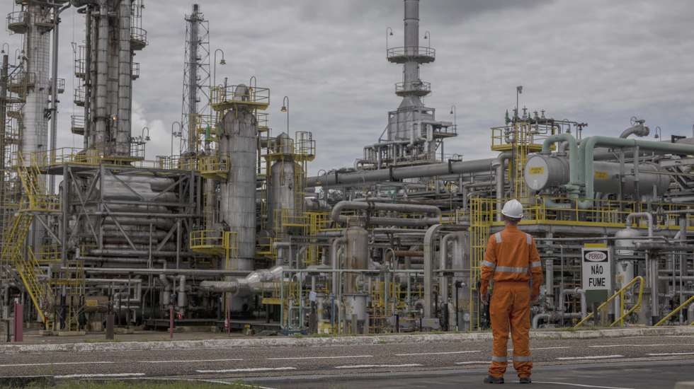 epa11302965 A Petrobras employee looks at a natural gas processing unit in the Urucu oil district, in Coari, Amazonas, Brazil, 23 April 2024 (issued 26 April 2024). Urucu is an oil field located in one of the most well-preserved regions of the Amazon. It supplies cooking gas to half of the Brazilian territory. Petrobras claims that it is feasible to extract hydrocarbons from the world's largest rainforest in a sustainable manner.  EPA/Isaac Fontana