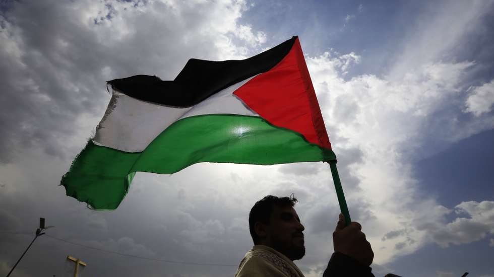 epa11366829 A Houthi supporter waves a Palestinian flag during a rally in solidarity with the Palestinian people, in Sana'a, Yemen, 24 May 2024. Thousands of Houthi supporters participated in a solidarity protest to support the Palestinian people in the midst of the current conflict between Israel and Hamas in the Gaza Strip. Houthisâ€™ leader, Abdul-Malik al-Houthi, claimed in a televised speech on 23 May that Yemen's Houthis have launched eight attacks against ships sailing in the Red Sea, the Gulf of Aden, and the Indian Ocean in the previous week, as well as an attack targeting the Mediterranean Sea, aiming to halting Israelâ€™s operations in Gaza.  EPA/YAHYA ARHAB
