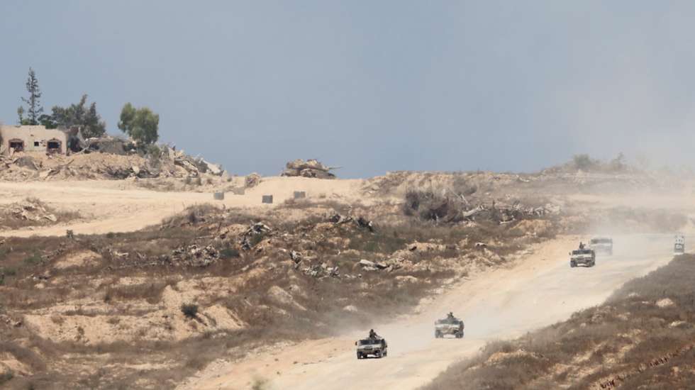 epa11472146 Israeli army vehicles patrol inside Gaza as seen from the Israeli side of the border with the Gaza Strip, southern Israel, 11 July 2024. More than 37,000 Palestinians and over 1,400 Israelis have been killed, according to the Palestinian Health Ministry and the Israel Defense Forces (IDF), since Hamas militants launched an attack against Israel from the Gaza Strip on 07 October 2023, and the Israeli operations in Gaza and the West Bank which followed it.  EPA/ABIR SULTAN