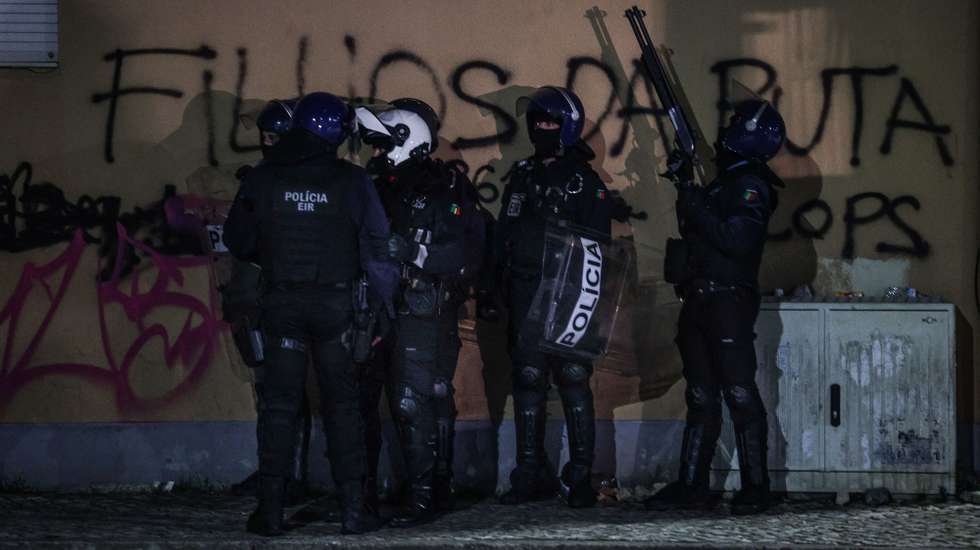 epa11676853 Members of police stand as they disperse residents of the Zambujal neighborhood protest in reaction following the death of a man shot by a police officer in Amadora, Lisbon, Portugal, 22 October 2024 (issued 23 October 2024). The riots that have been going on since 21 October following the death of a man shot by the PSP spread to various areas of Lisbon, including Carnaxide (Oeiras), Casal de Cambra (Sintra), and Damaia (Amadora).  EPA/MIGUEL A.LOPES
