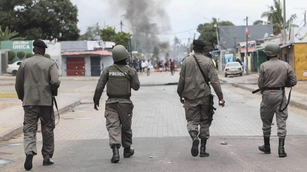 epa11673019 Members of Mozambican police walk as they disperse people gathering to take part in the peaceful marches called by presidential candidate Venancio Mondlane to repudiate the murder of two supporters, in Maputo, Mozambique, 21 October 2024. According to police, Elvino Dias, Mondlane's lawyer, and Paulo Guambe, a member of the Podemos Party, were killed on 18 October while traveling on a vehicle on Avenida Joaquim Chissano, in the capital's center.  EPA/LUISA NHANTUMBO