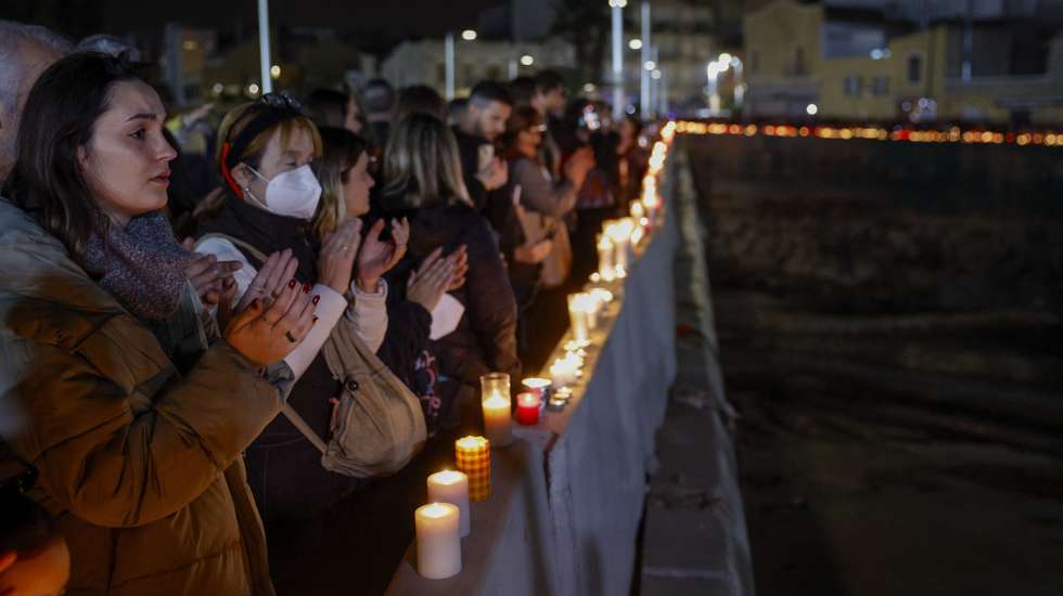 epa11748405 People place candles in tribute to the flood victims in the Poyo ravine in Paiporta, Spain, 29 November 2024, one month after the floods struck the area. Floods triggered by the DANA (high-altitude isolated depression) weather phenomenon hit the east of the country on 29 October 2024, devastating Valencia and neighboring provinces and leaving at least 229 people dead.  EPA/KAI FORSTERLING