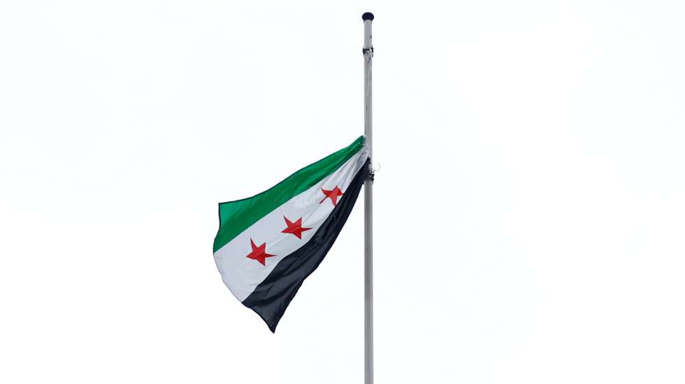 epaselect epa11767007 A Syrian opposition flag is hoisted at the Syrian embassy in Paris, France, 09 December 2024. Syrian rebels entered Damascus on 08 December 2024 and announced in a televised statement the 'Liberation of the city of Damascus and the overthrow of Bashar al-Assad', as well as the release of all the prisoners.  EPA/MOHAMMED BADRA