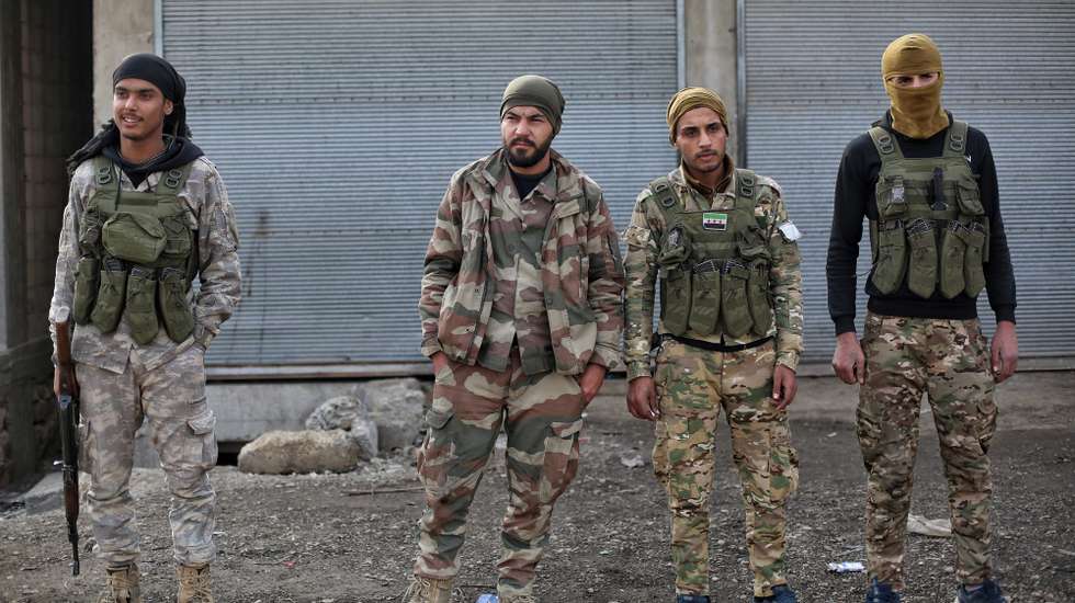 epa11805851 Syrian opposition fighters secure the area near Manbij city, northern Syria, 04 January 2025. A group of opposition fighters from the National Army gathered near Manbij to launch a military operation against the positions of the Syrian Democratic Forces (SDF) in Tishreen Dam near the city of Manbij in northern Syria.  EPA/BILAL AL HAMMOUD