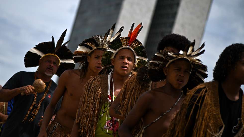 epa11961649 Indigenous people from the Pataxo and Tupinamba participate in a demonstration in front of the Supreme Court in Brasilia, Brazil, 13 March 2025.  EPA/Andre Borges