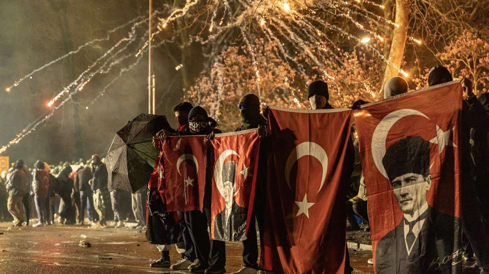 epaselect epa11983949 Protesters carry flags as they try to march to Taksim Square from the Istanbul Municipality headquarters during a protest against the detention of Istanbul Mayor Ekrem Imamoglu in Istanbul, Turkey, 23 March 2025. Istanbul Mayor Ekrem Imamoglu of the Republican People's Party (CHP) was jailed and dismissed by the Turkish Ministry of Interior on 23 March on corruption charges following his detention on March 19 along with 100 others.  EPA/ERDEM SAHIN