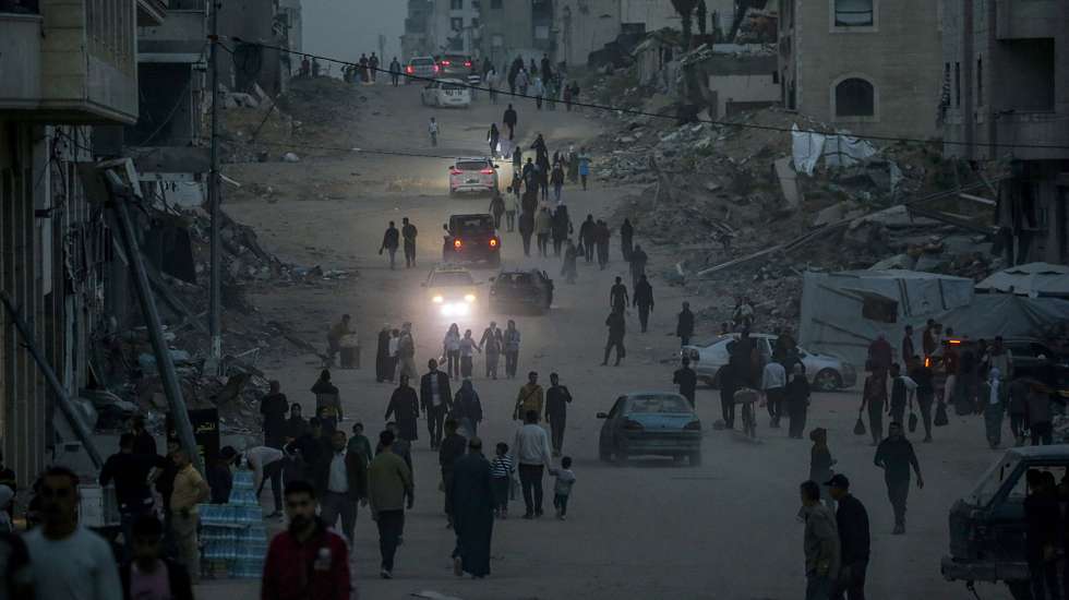 epaselect epa12003917 Internally displaced Palestinians walk along a street near the rubble of destroyed buidlings after fleeing northern Gaza following an Israeli army evacuation order, in Gaza City, Gaza Strip, 01 April 2025. More than 50,000 Palestinians have been killed in the Gaza Strip, according to the Palestinian Ministry of Health, since Israel launched a military campaign in the strip in response to a cross-border attack led by the Palestinian militant group Hamas on 07 October 2023, in which about 1,200 Israelis were killed and more than 250 taken hostage.  EPA/MOHAMMED SABER