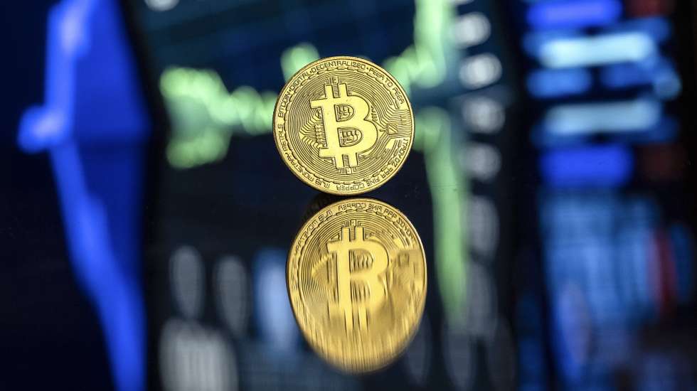 epa11734557 An illustration shows a symbolic Bitcoin, in Lugano, Switzerland, 22 November 2024. The world's most popular cryptocurrency hit a record high on 21 November, approaching the 100,000 US dollar (USD) mark. Bitcoin has been regularly hitting fresh records this month on hopes that US President-elect Donald Trump will usher in a golden age of cryptocurrencies.  EPA/PABLO GIANINAZZI