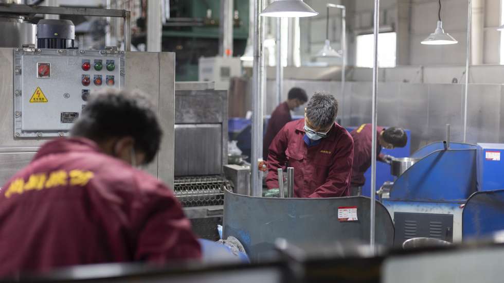 epa11992048 Workers are seen at the Lotus Snow Plateau cookware factory during a government-organized media tour in Lhasa, Tibet Autonomous Region, China, 27 March 2025.  EPA/ANDRES MARTINEZ CASARES