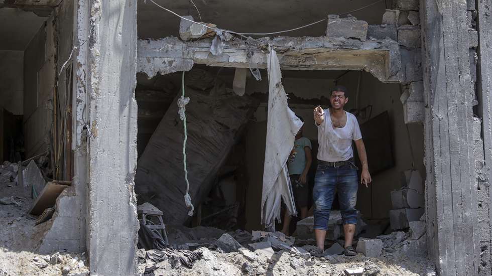 epa12161925 A man gestures near the rubble of a destroyed house following an Israeli airstrike on Al Sabra neighborhood in Gaza City, the Gaza Strip, 07 June 2025. According to the Palestinian Civil Defense in Gaza, at least 15 people were killed and several others were injured after the strike. More than 54,600 Palestinians have been killed in the Gaza Strip, according to the Palestinian Ministry of Health, since Israel launched a military campaign in the strip in response to a cross-border attack led by the Palestinian militant group Hamas on 07 October 2023, in which about 1,200 Israelis were killed and more than 250 taken hostage.  EPA/MOHAMMED SABER