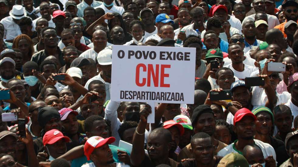 Demonstrators hold a poster 'The People Demand a Dispartisan CNE' during a march for the pacification of Angola, called by National Union for the Total Independence of Angola (UNITA), in Luanda, Angola, 24 September 2022. The National Union for the Total Independence of Angola (UNITA) promotes today, one month after the Angolan elections, a march in defense of the democratic state and the rule of law and for the release of political prisoners. AMPE ROGERIO/LUSA