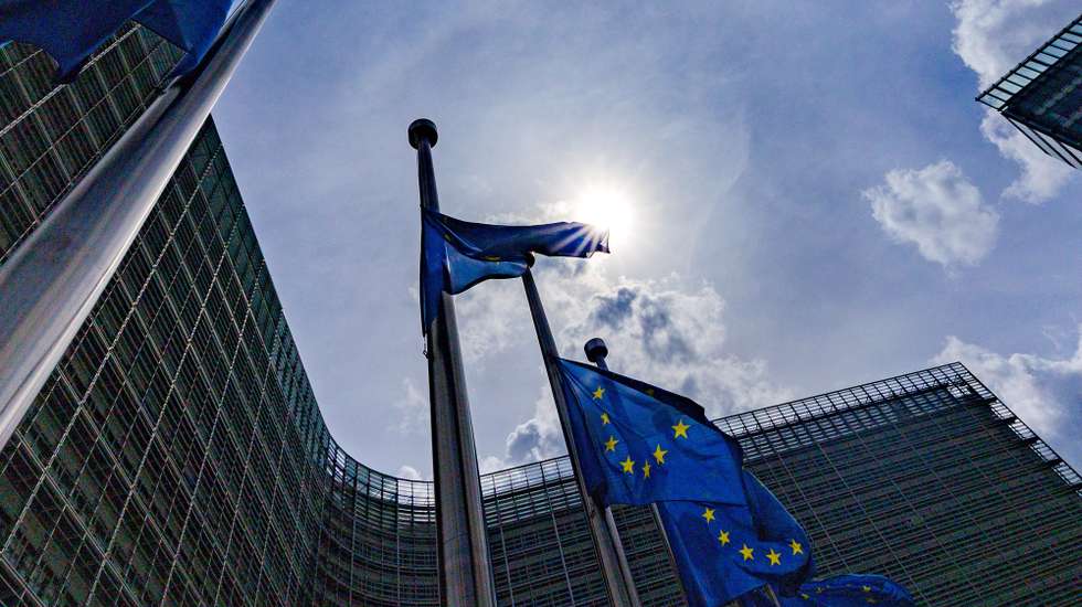 epa12046762 EU flags fly at half-mast in front of the European Commission headquarters, one day after the death of Pope Francis, in Brussels, Belgium, 22 April 2025. Pope Francis died on 21 April 2025 at the age of 88, according to the Holy See.  EPA/OLIVIER MATTHYS