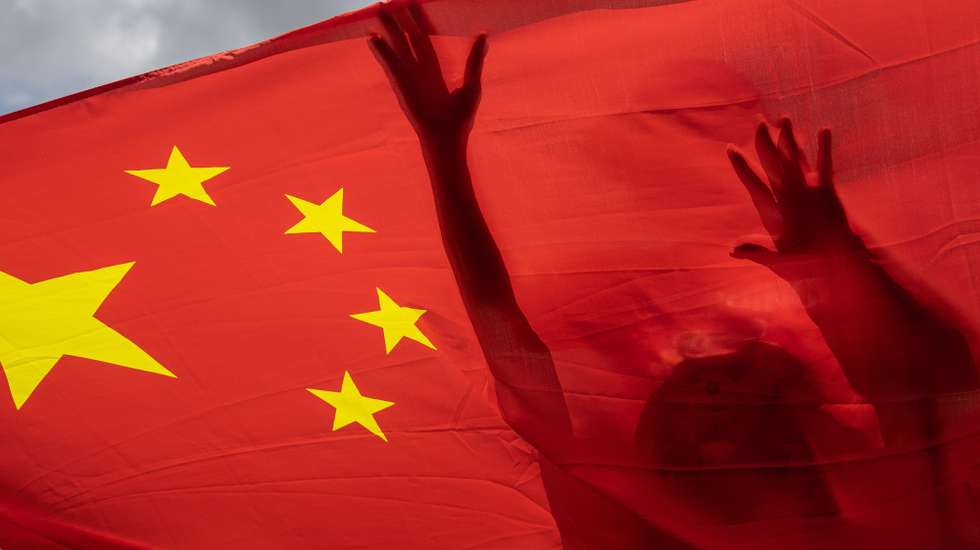 epa12205628 (FILE) - Pro-China supporters carry a Chinese national flag during a rally celebrating the passage of the national security law for Hong Kong, in Hong Kong, China, 30 June 2020  (reissued 30 June 2025). The fifth anniversary of Hong Kong's National Security Law is marked on 30 June 2025.  EPA/JEROME FAVRE *** Local Caption *** 56184614