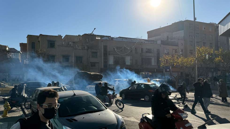 epa12616911 Iranian shopkeepers and traders protest against the economic conditions, as tear gas is fired by anti-riot police in Tehran, Iran, 29 December 2025. Iran is experiencing an economic crisis as the value of its currency declines as a result of tensions between Iran, Israel, and the USA as well as sanctions implemented by the US and EU against Iran.  EPA/STRINGER
