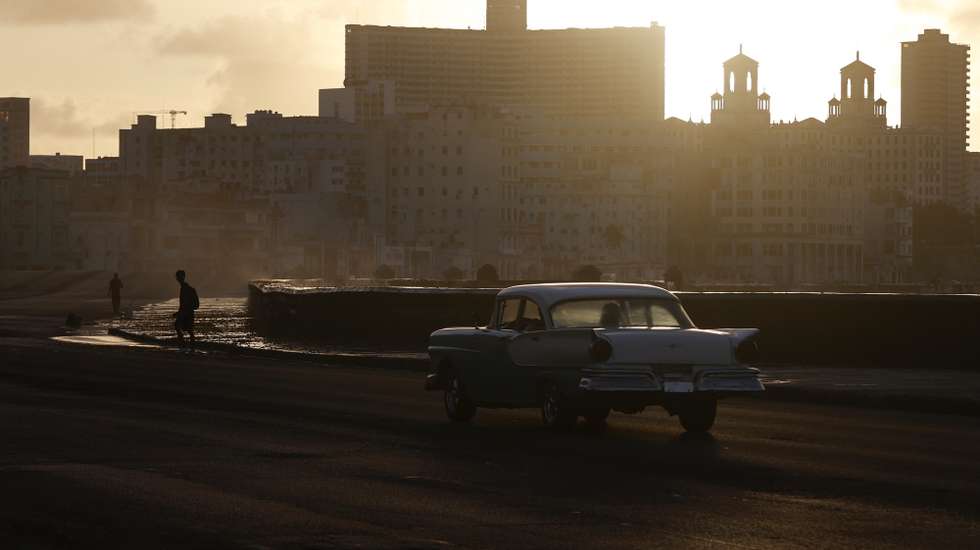epa12880865 A classic car drives along an area of the Malecon in Havana, Cuba, 09 April 2026 (issued 10 April 2026), as the island continues to struggle with the impacts of a severe energy crisis amid the oil embargo imposed by the US government since January 2026.  EPA/ERNESTO MASTRASCUSA