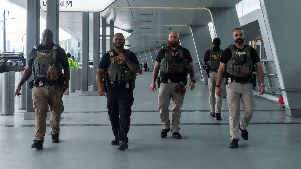 epa12854954 Immigration and Customs Enforcement (ICE) officers walk outside Terminal B of LaGuardia International Airport in New York, New York, USA, 27 March 2026. ICE officers were deployed at major U.S. airports to support security operations during severe TSA staffing shortages.  EPA/OLGA FEDOROVA