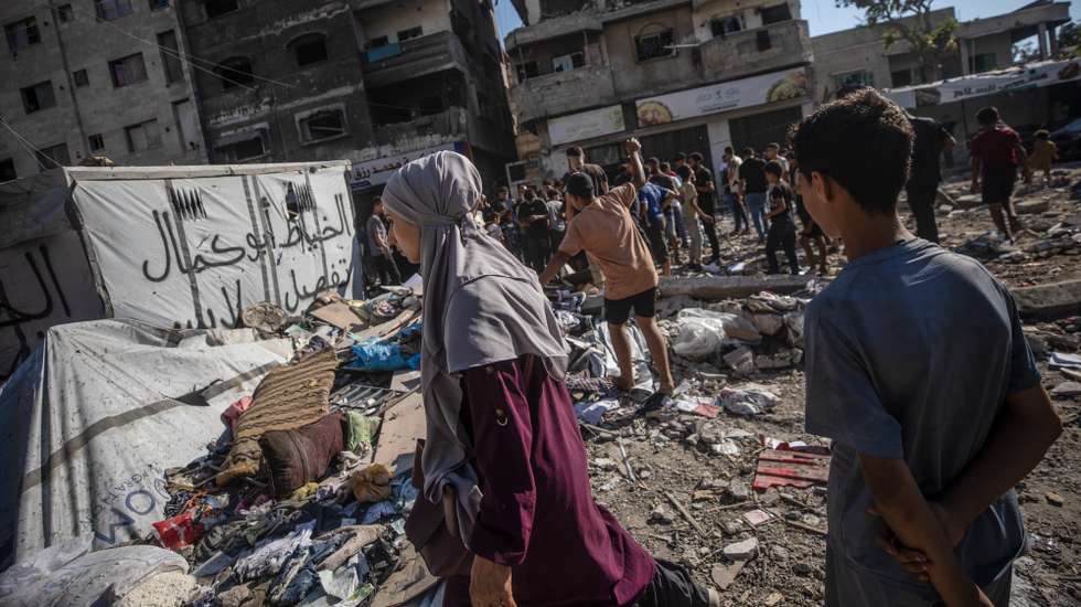 epa13118945 Palestinians inspect a house destroyed in an Israeli airstrike in northern Gaza City, Gaza Strip, 18 July 2026. At least five Palestinians were killed in the attack on the house, according to the Gaza Health Ministry.  EPA/MOHAMMED SABER