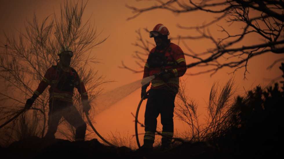 Firefighters fight the flames during a wildfire in Valpacos, Portugal, 30th July 2026. The fire, which broke out on Tuesday in the municipality of Valpaços and spread to those of Mirandela and Vinhais, has three active fronts this evening, and additional resources and personnel have been deployed, according to the Civil Protection Agency. PEDRO SARMENTO COSTA/LUSA