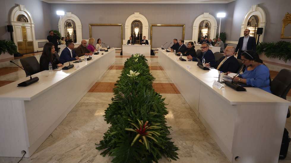 epa13305177 Venezuelan National Assembly President Jorge Rodriguez (C-L), Dinorah Figuera (C-R), head of the opposition negotiating delegation, and other participants take part in the third round of political talks in Caracas, Venezuela, 14 October 2026. The US-backed negotiations between the interim government and a sector of the opposition focus on political and civil guarantees for future elections and judicial reforms.  EPA/RONALD PENA R