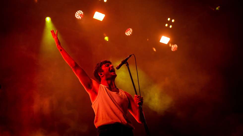 epa10056070 The lead singer of the Irish band Fontaines D.C., Grian Chatten, performs during the Nos Alive Festival in Oeiras, outskirts of Lisbon, Portugal, 06 July 2022. The festival runs until 09 July.  EPA/JOSE SENA GOULAO