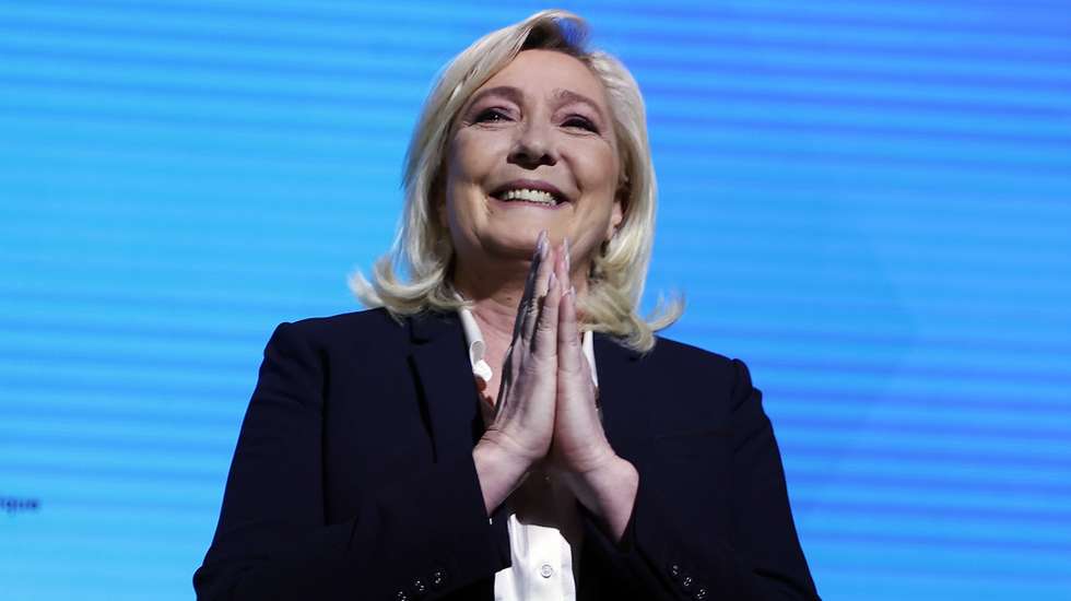 epa09883257 Candidate to the 2022 presidential election for the far-right Rassemblement National (RN) party Marine Le Pen delivers a speech after results in the first round of the French presidential elections in Paris, France, 10 April 2022.According to initial exit polls French far-right Rassemblement National (RN) party candidate Marine Le Pen received around 24 percent of votes and will face French President Macron in the second round on 24 April 2022.  EPA/IAN LANGSDON