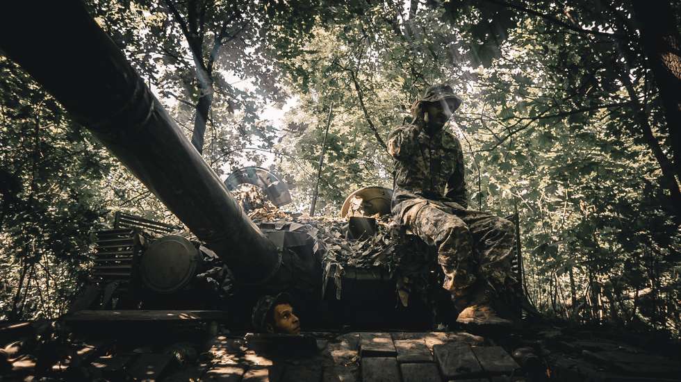 epa10724675 Members of Ukraine's 59th Separate Motorized Infantry Brigade named after Yakiv Handziuk during repair work on a tank near a frontline in the Donetsk direction, eastern Ukraine, 02 July 2023 (issued 03 July 2023), amid the Russian invasion. Russian troops entered Ukrainian territory in February 2022, starting a conflict that has provoked destruction and a humanitarian crisis.  EPA/NIKOLETTA STOYANOVA