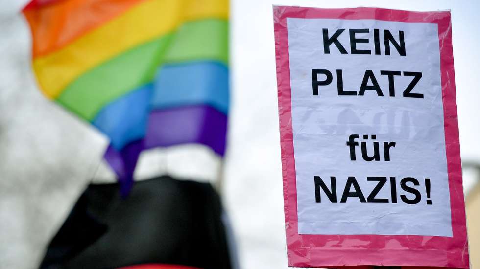 epaselect epa08119352 Counter demonstrators show banners reading 'No place for Nazis!' as they react to right-wing protesters gathering at the city hall of Kamp-Lintfort, Germany, 11 January 2020. The extreme right-wing party 'Die Rechte' has called for a rally against the mayor of Kamp-Lintfort, Christoph Landscheidt. Due to threats from the right-wing scene, the mayor has applied for a gun license for his protection. Landscheidt is suing the Duesseldorf Administrative Court for a large fire-arms license after it was denied by the responsible authorities.  EPA/SASCHA STEINBACH