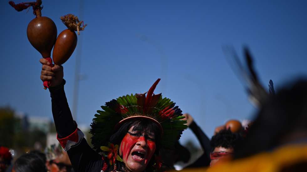 epa11440594 An indigenous man participates in a protest against government investments in the agricultural sector in Brasilia, Brazil, 26 June 2024. A hundred indigenous Brazilians protested on 26 June against the government of Luiz Inacio Lula da Silva, over the millions of dollars in aid granted to the booming agricultural sector, with which they are at loggerheads over land tenure. In the Brazilian capital, the indigenous people criticized that the funds destined to the native peoples and to the process of delimitation and regularization of their lands are 'insignificant' in comparison with those received by the landowners.  EPA/Andre Borges