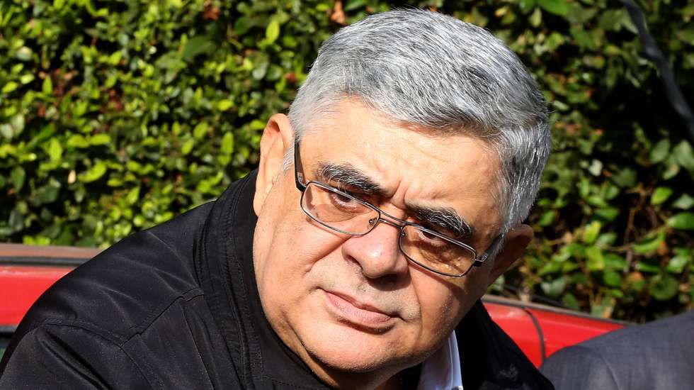 epa08765034 Leader of the neo-nazi criminal organization Golden Dawn, Nikos Michaloliakos leaves his residence and enters a car in order to surrender to the General Police Directorate of Attica, in Athens, Greece, 22 October 2020. Presiding judge Maria Lepeniotou declared the conclusion of the Go​lden Dawn trial, after the court announced that its leadership and the majority of the defendants found guilty during the proceedings will go straight​ to jail. Only 12 were given suspended sentences and will remain free but with restrictions until their case goes to appeal.  EPA/ORESTIS PANAGIOTOU