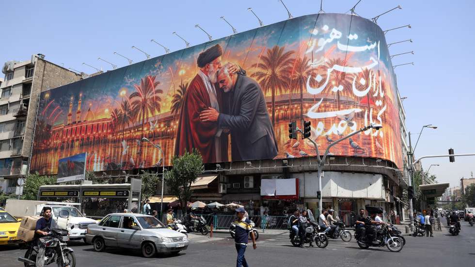 epa13071948 Iranians drive past a billboard featuring a picture of Iran's late Supreme Leader Ayatollah Ali Khamenei ahead of his funeral in Tehran, Iran, 29 June 2026. Iran is set to hold a multi-day mass funeral for the late supreme leader, amid heightened regional tensions following recent exchanges of fire between Iran and the US despite a recently signed agreement.  EPA/ABEDIN TAHERKENAREH RESTRICTIONS: NO Access Israel Media/Persian Language TV Stations Outside Iran/Strictly No Access BBC Persian/VOA Persian/Manoto TV/Iran International TV. (As mandated by Iran's Directorate General for Foreign Media) --