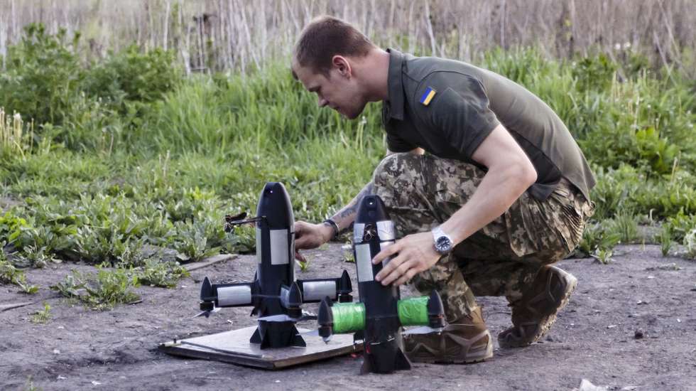 epa12981166 A serviceman of the 116th Mechanized Brigade operates a Ukraine-made P1-Sun drone to intercept Russian 'Shahed' type, and other strike or reconnaissance drones in the north of the Kharkiv region, northeastern Ukraine, 20 May 2026 (issued 21 May 2026), amid the Russian invasion.  EPA/YEVHEN TITOV