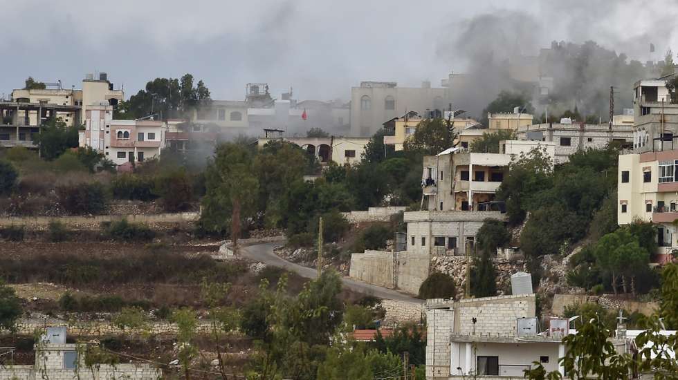 epa10920060 Smoke rises after Israeli army shelling on Ayta ash-Shab village, near the Lebanese-Israeli border, Lebanon, 15 October 2023. According to the Israeli Defense Forces (IDF), anti-tank missiles were fired at soldiers operating along the Lebanese border, and Israeli forces responded by striking Hezbollah military targets.  EPA/WAEL HAMZEH