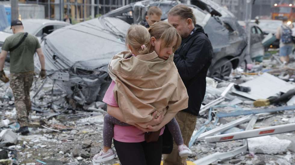 epa13090530 Local people react at the site of Russian strike on a residential building during a large-scale combined attack on a residential area in Kyiv, Ukraine, 06 July 2026, amid the Russian invasion. At least 10 people were killed and more than 43 injured after the overnight attack on Kyiv, according to the State Emergency Service. Russia launched 351 drones and 68 missiles of various types during the attack on Ukraine, the Air Force reported, with Kyiv as the primary target.  EPA/SERGEY DOLZHENKO