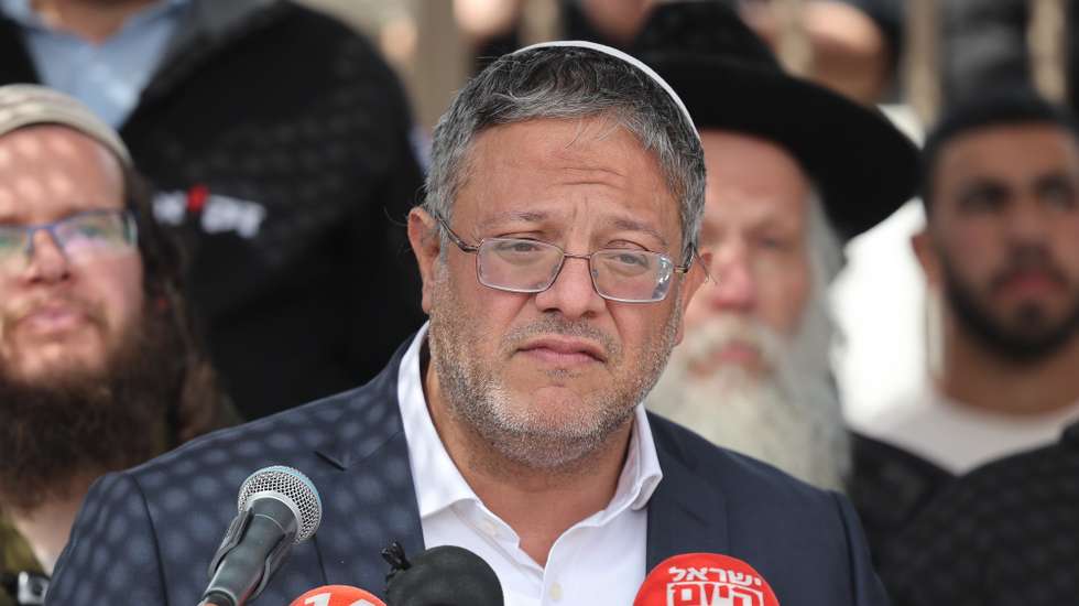 epa11190290 Israel's Minister of National Security Itamar Ben Gvir speaks during the funeral of Yitzhak Zeiger, 57, in Jerusalem, 01 March 2024. Zeiger is one of two Israeli victims of a shooting that occurred on 29 February near the West Bank settlement of Eli.  EPA/ABIR SULTAN