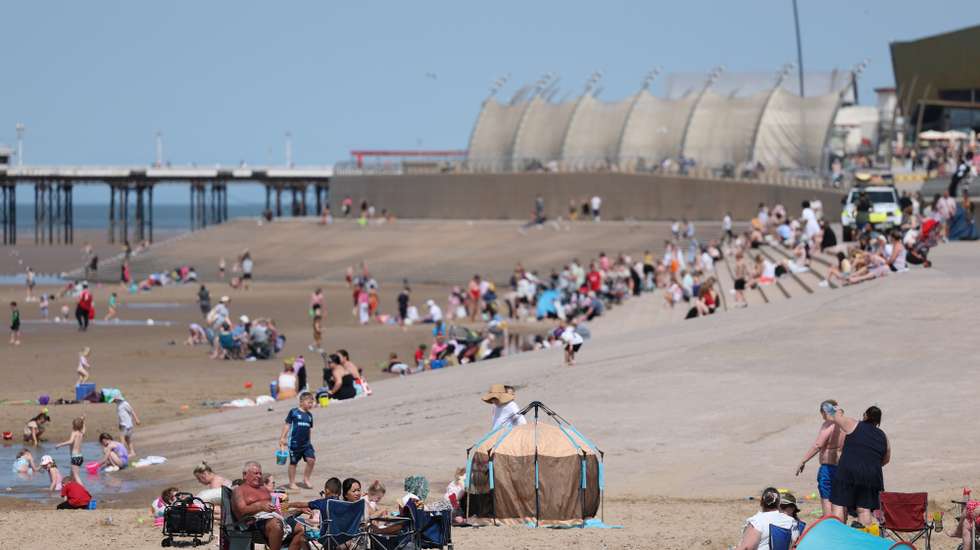 epa12997832 People spend time on the beach at the seaside resort of Blackpool, Britain, 27 May 2026. The UK is experiencing a record-breaking heatwave, with temperatures exceeding 35 degrees Celsius, marking the hottest May on record.  EPA/ADAM VAUGHAN