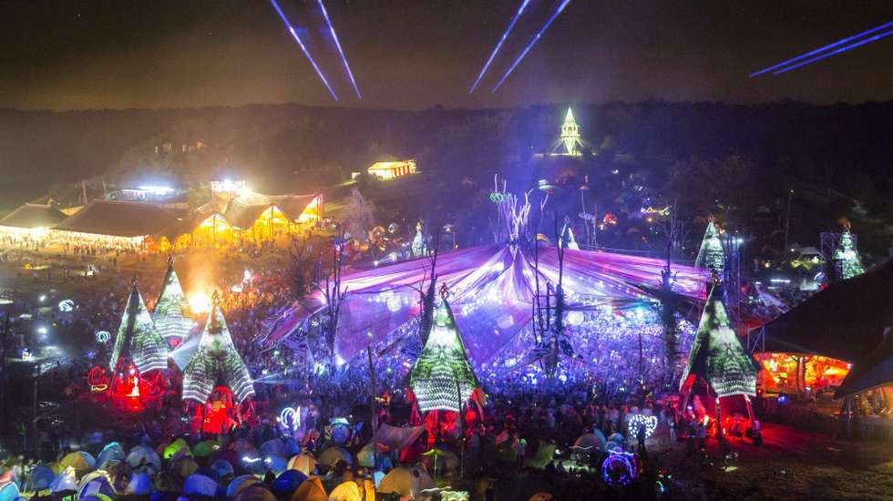 epa05454729 Festivalgoer gather around the main stage during the 13th O.Z.O.R.A. Festival near the village of Ozora, 123 km south of Budapest, Hungary, 03 August 2016 (issued 04 August). The seven-day festival is one of the largest psychedelic trance music festivals in Europe. The first gathering took place during the Solar eclipse on 11 August 1999. Since then, the festival has been a meeting point for the lovers of psychedelic music and ancient transcendental culture. During the festival, visitors can enjoy arts, theater, underground circus, lectures as well as various workshops. The festival runs until 07 August.  EPA/BALAZS MOHAI HUNGARY OUT