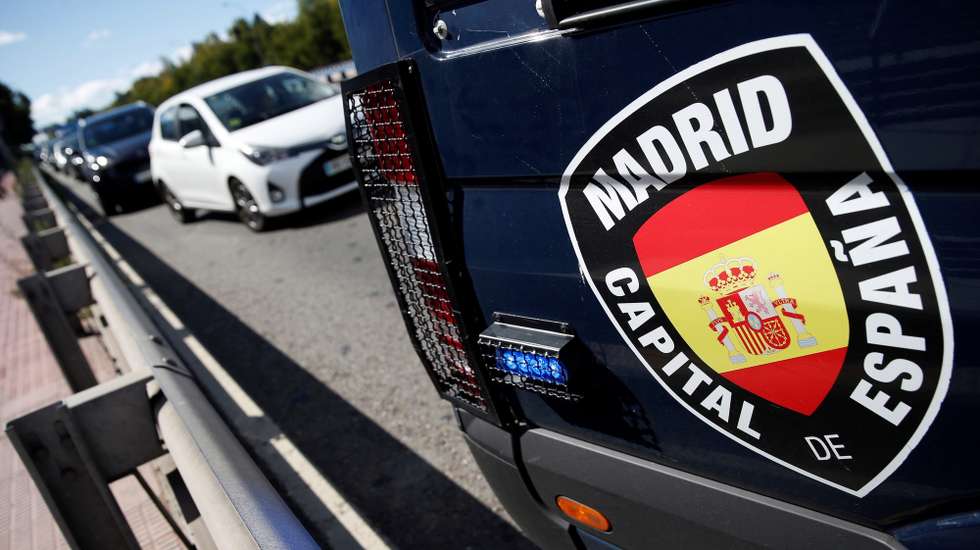 epa08717157 Close-up view of a banner reading 'Madrid, Capital of Spain' seen on a local police vehicle at a roadblock in Madrid, Spain, 03 October 2020. Some five million people residing in the 10 bigger towns of the greater Madrid region, including the Madrid metro area, have been imposed with new restrictions to contain the spreading of the SARS-CoV-2 coronavirus which causes the COVID-19 disease since 03 October.  EPA/MARISCAL