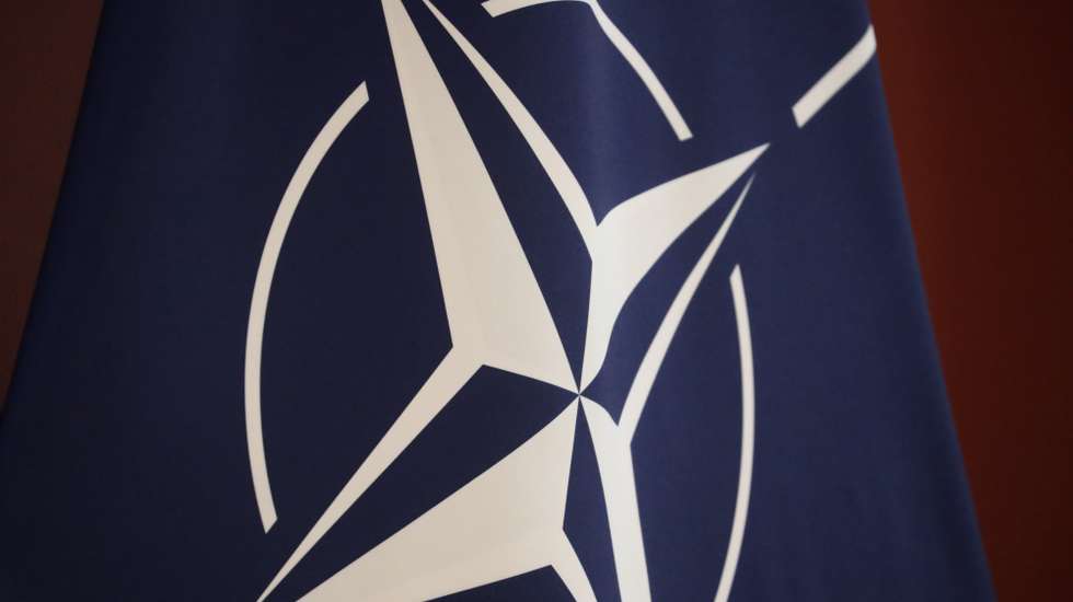 epa09861591 The NATO flag is seen during a meeting of the Danish Prime Minister and the Latvian Prime Minister (both not pictured) in Riga, Latvia, 31 March 2022. The Latvian Prime Minister and Danish Prime Minister discussed, during the meeting, the security situation in Europe, support for Ukraine and further steps towards the international isolation of the Putin regime following Russia's agression against Ukraine. They also discussed energy security and investment in renewable energy, as well as how EU countries will rapidly reduce dependence on Russian energy.  EPA/TOMS KALNINS